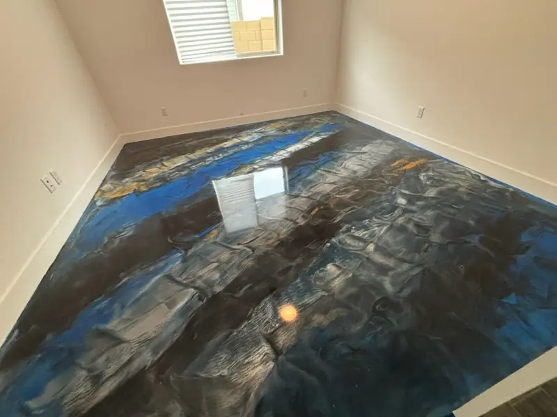 Blue metallic epoxy floor with a marbled pattern
