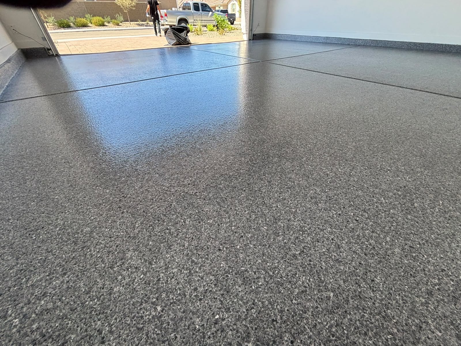 Close view of a grey flake finish with a gloss top coat
